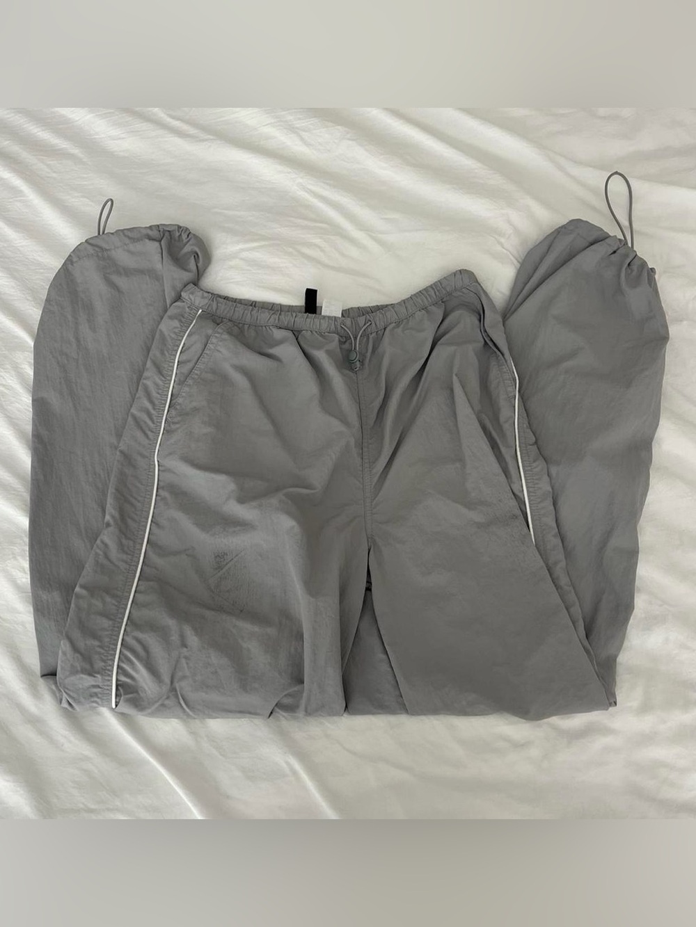 grey and white h&m divided parachute pants